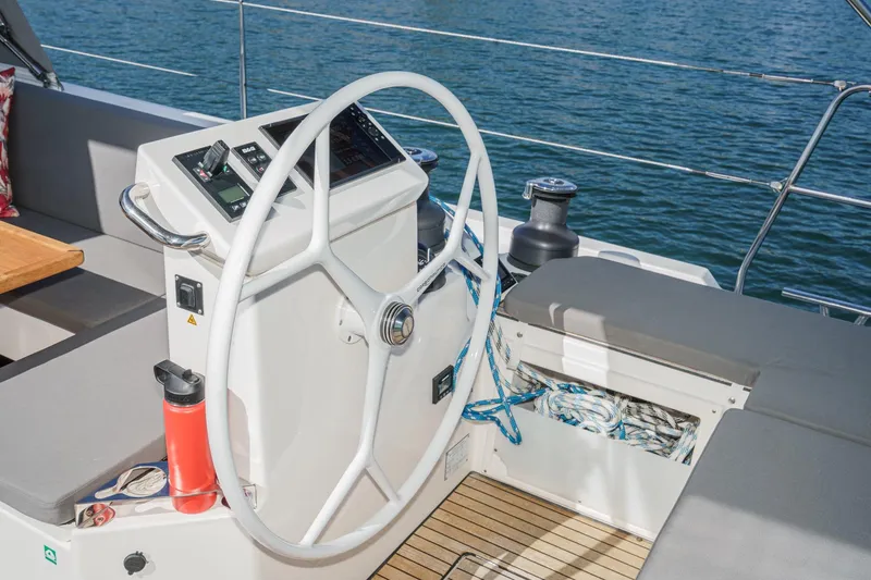 Slide: The Image of Steering wheel of 2023 Bavaria C50 yacht with nautical equipment and ocean view. - 19