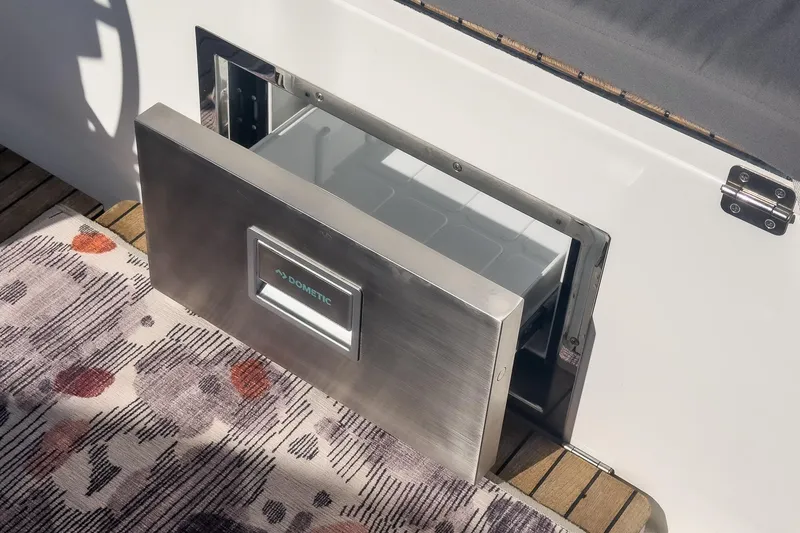 Slide: The Image of Built-in Dometic drawer fridge on 2023 Bavaria C50 yacht deck. - 23