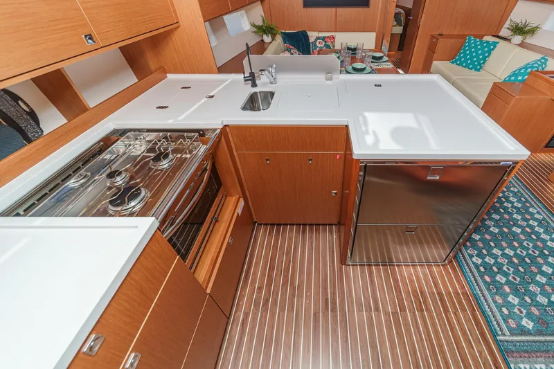 Slide: The Image of Modern kitchen interior of 2023 Bavaria C50 yacht with sleek wood cabinetry and appliances. - 36