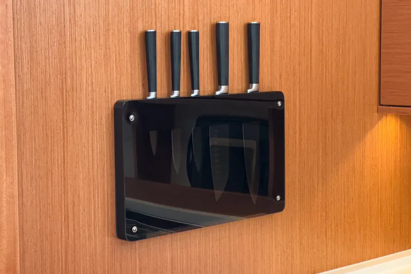 Slide: The Image of Knife set on wooden wall in 2023 Bavaria C50 yacht kitchen. - 41