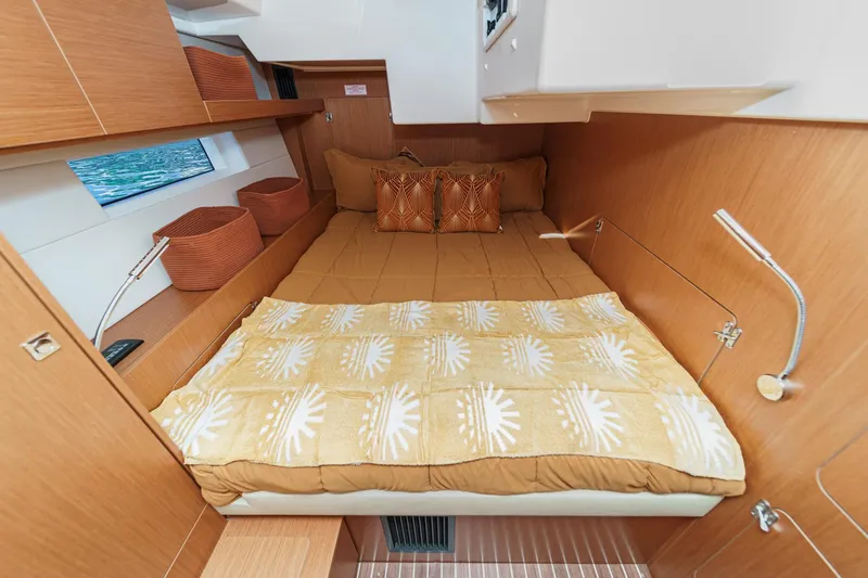Slide: The Image of Cozy cabin interior of 2023 Bavaria C50 yacht with comfortable bedding and wooden finish. - 48