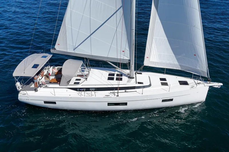 Slide: The Image of 2023 Bavaria C50 sailboat cruising on open water with full sails. - 5