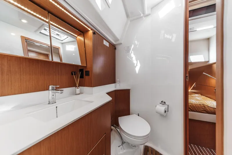 Slide: The Image of Luxurious 2023 Bavaria C50 yacht bathroom with modern fixtures and wooden accents. - 53
