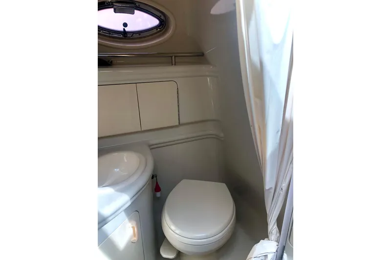 Slide: The Image of 2007 Sea Ray 280 Sundancer bathroom interior with toilet and sink. - 8