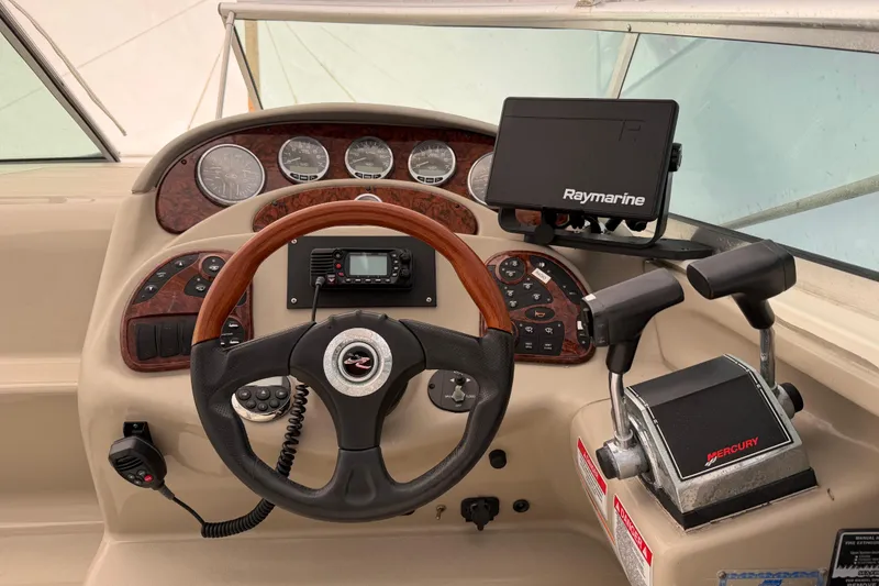 Slide: The Image of 2007 Sea Ray Sundancer 280 helm with Raymarine navigation and Mercury controls. - 13