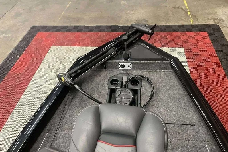 Slide: The Image of 2024 Tracker Pro Team 175 TXW boat interior with trolling motor and seating. - 6