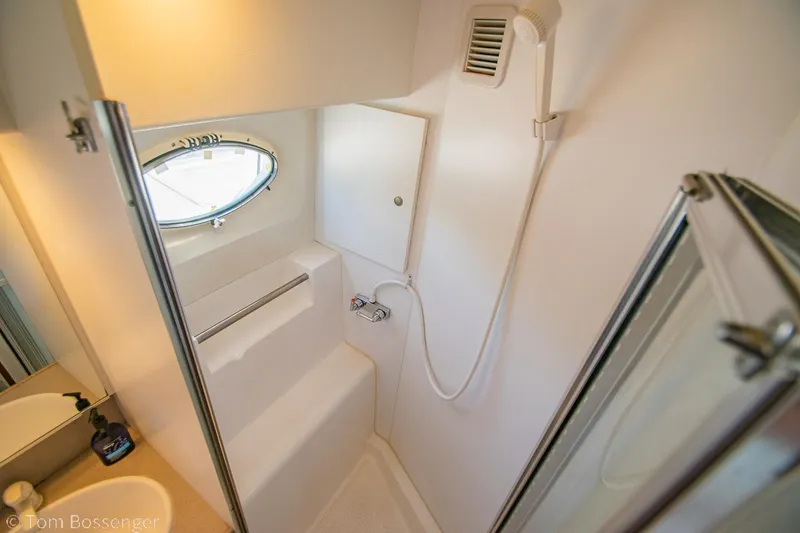 Slide: The Image of Bathroom interior of 1996 Silverton 372 Motor Yacht with shower and sink. - 23