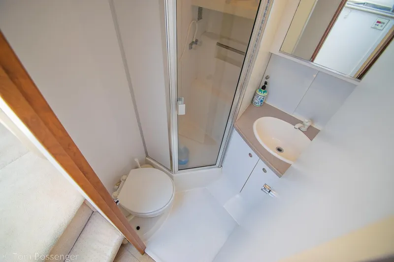 Slide: The Image of Bathroom interior of 1996 Silverton 372 Motor Yacht with shower and sink. - 27