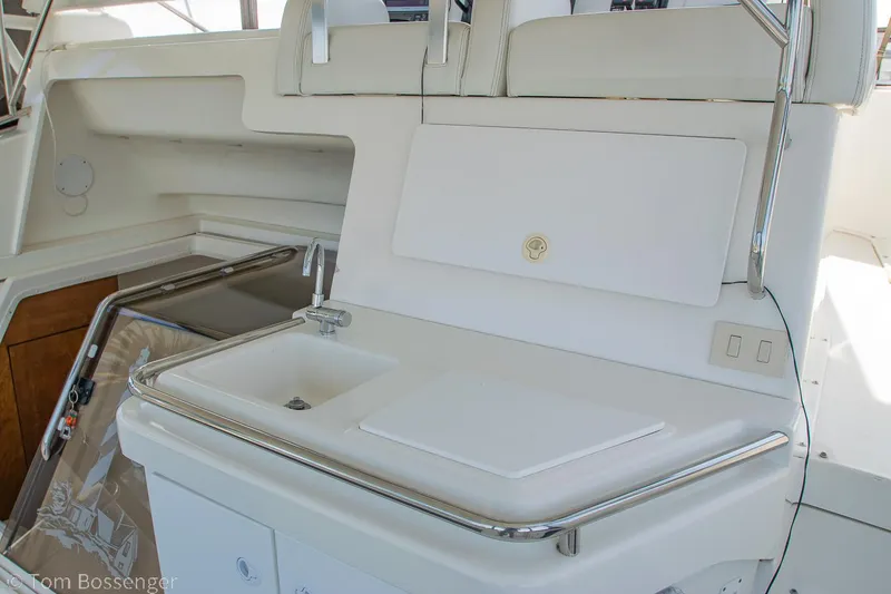 Slide: The Image of 1996 Silverton 372 Motor Yacht interior with sink and storage area. - 32