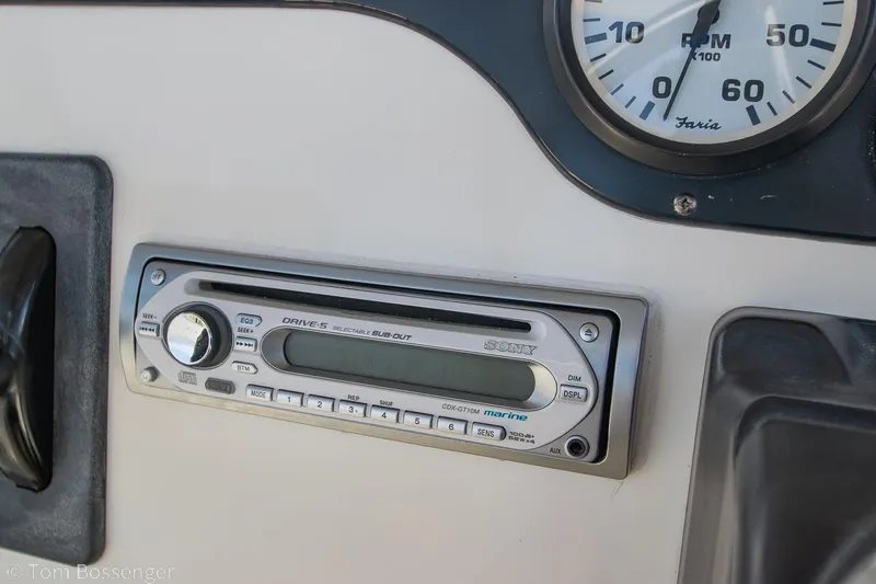 Slide: The Image of 1996 Silverton 372 Motor Yacht dashboard with Sony marine stereo and RPM gauge. - 43