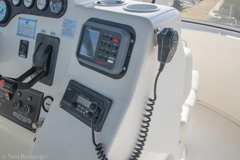 Slide: The Image of Control panel of a 1996 Silverton 372 Motor Yacht with navigation and communication equipment. - 47