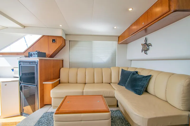 Slide: The Image of Luxurious interior of 1996 Silverton 372 Motor Yacht with beige seating and modern amenities. - 9