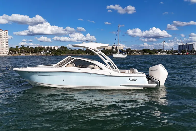 The Image of 2024 Scout 240 Dorado boat on water, clear sky, coastal background. - 0