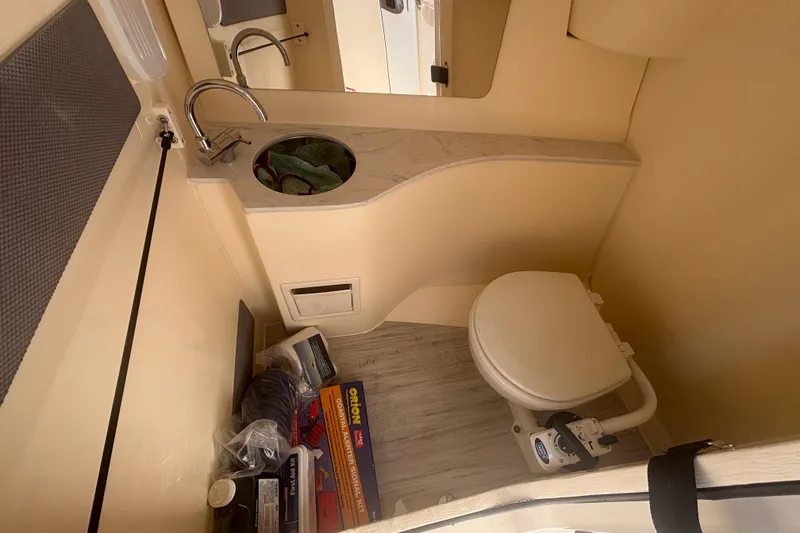 Slide: The Image of 2024 Scout 240 Dorado boat interior with sink and toilet. - 24