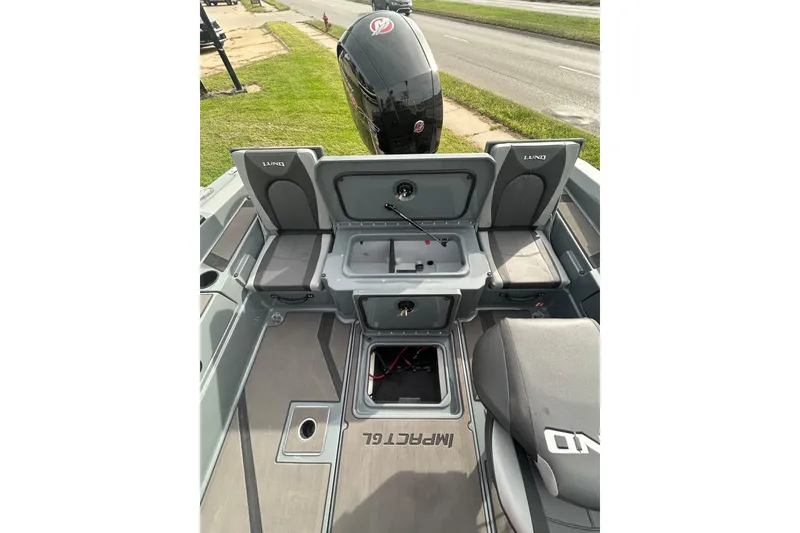 Slide: The Image of 2026 Lund 185 Impact GL boat interior with seating and storage compartments. - 13