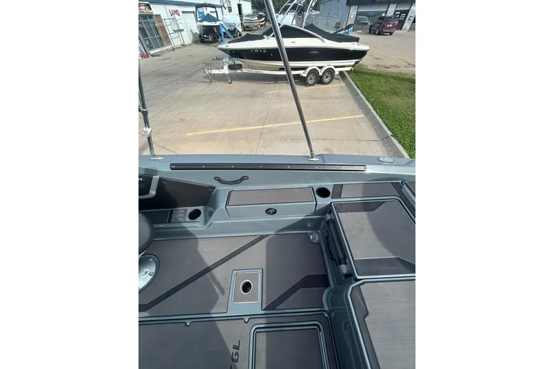 Slide: The Image of 2026 Lund 185 Impact GL boat interior with storage compartments and seating. - 15