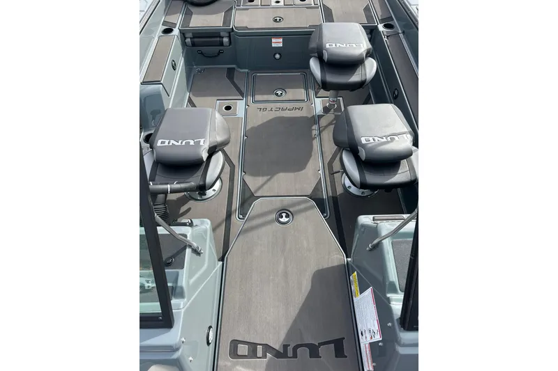Slide: The Image of 2026 Lund 185 Impact GL boat interior with seating and storage compartments. - 23