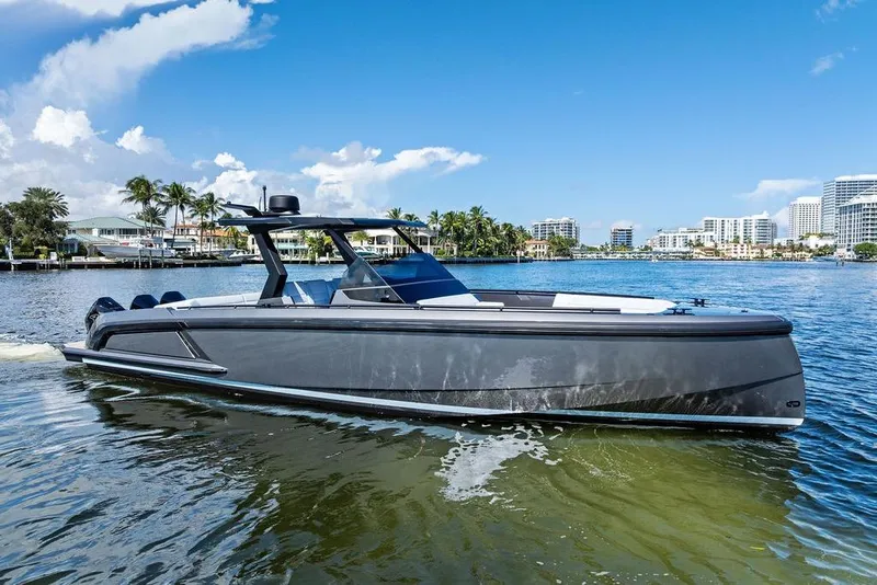 Slide: The Image of 2024 Vanquish Yachts 40 on water, sleek design, modern cityscape background. - 10