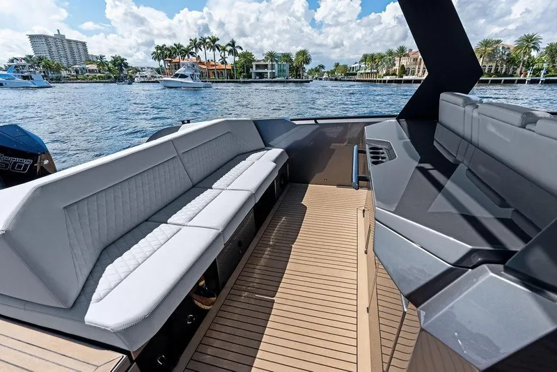 Slide: The Image of 2024 Vanquish Yachts 40 interior with luxurious seating and scenic waterfront view. - 29