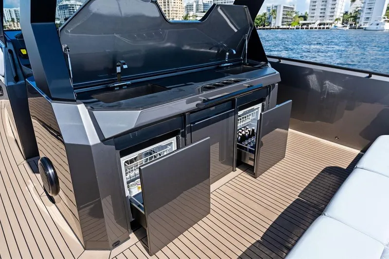 Slide: The Image of Luxury outdoor kitchen on 2024 Vanquish Yachts 40, featuring sleek cabinetry and modern appliances. - 32
