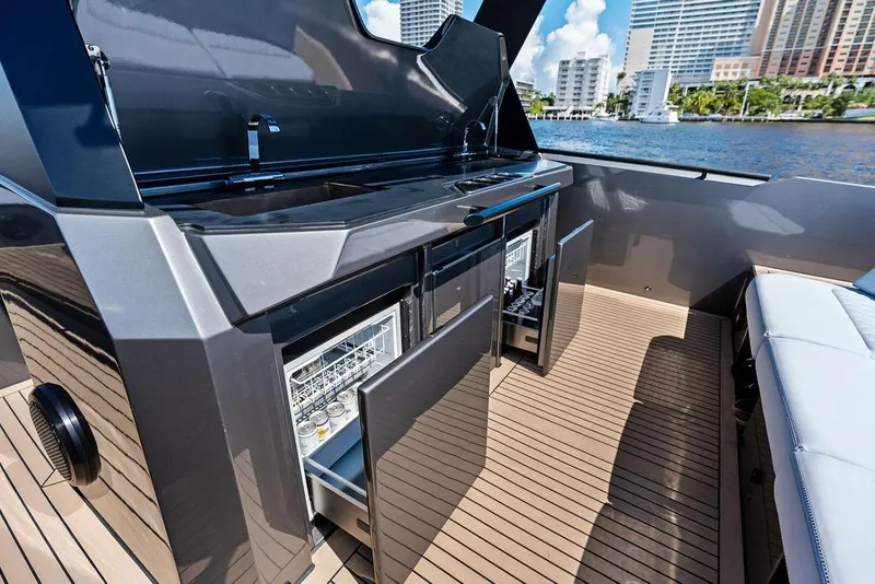 Slide: The Image of 2024 Vanquish Yachts 40 interior with open cabinets and modern amenities. - 33