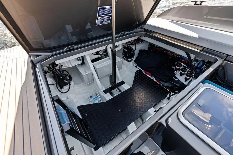 Slide: The Image of Open engine compartment of 2024 Vanquish Yachts 40, showcasing internal components and storage. - 36