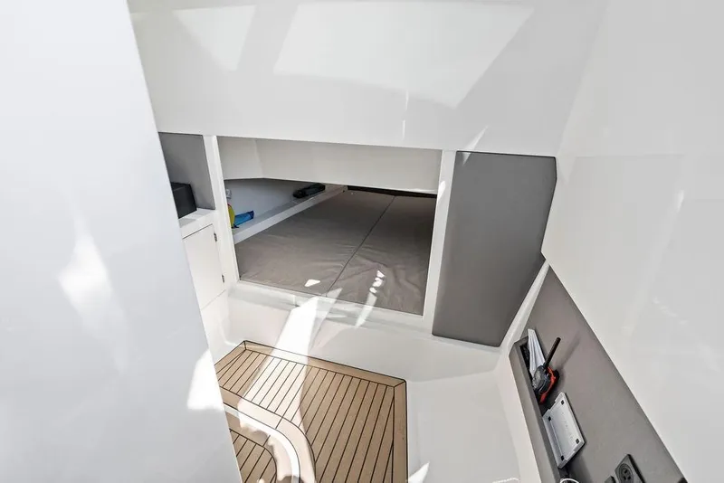 Slide: The Image of 2024 Vanquish Yachts 40 interior cabin with modern design and wooden flooring. - 37