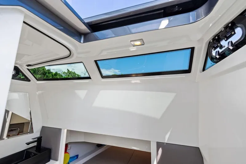 Slide: The Image of Interior view of 2024 Vanquish Yachts 40, featuring sleek design and skylight windows. - 38