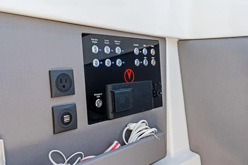 Slide: The Image of Control panel of 2024 Vanquish Yachts 40 with switches and outlets. - 40