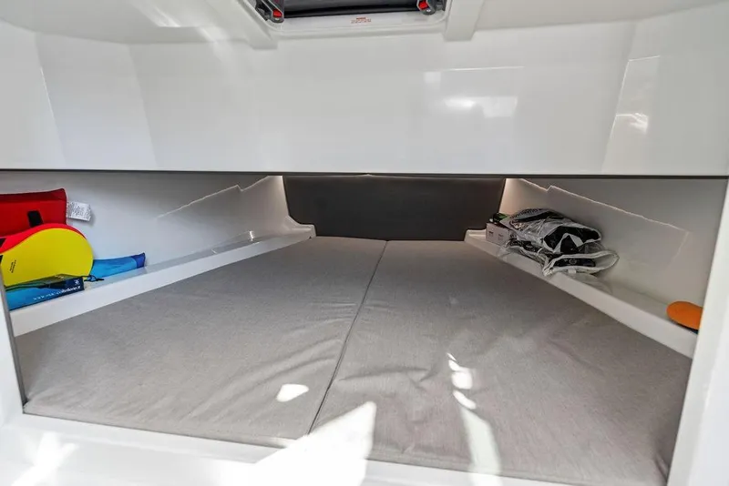Slide: The Image of 2024 Vanquish Yachts 40 interior cabin with storage and sleeping area. - 41