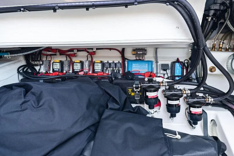 Slide: The Image of Engine compartment of 2024 Vanquish Yachts 40, showcasing wiring and components. - 46