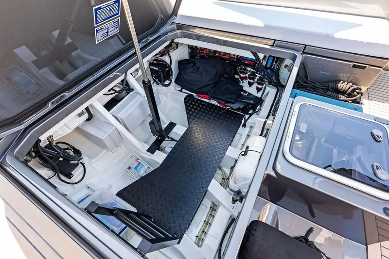 Slide: The Image of 2024 Vanquish Yachts 40 engine compartment, showcasing organized storage and mechanical components. - 48