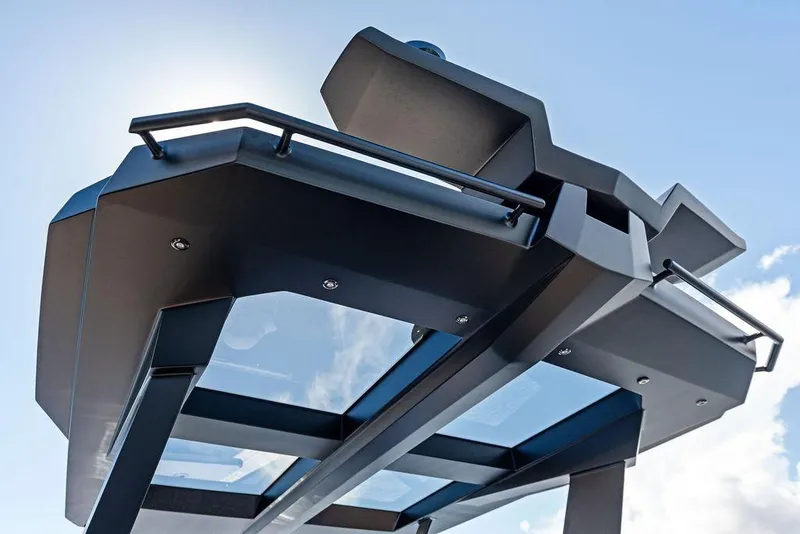 Slide: The Image of 2024 Vanquish Yachts 40, sleek design detail against a clear blue sky. - 50