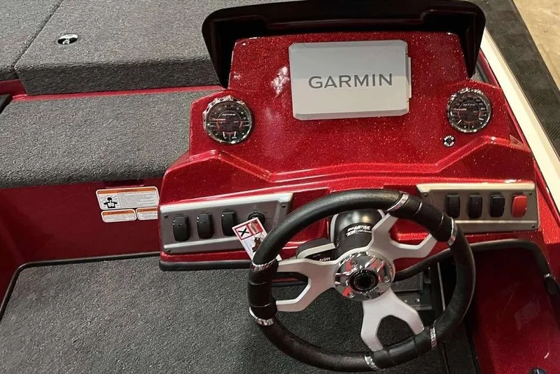 Slide: The Image of Red Nitro Z18 Pro 2026 boat dashboard with Garmin display and steering wheel. - 3