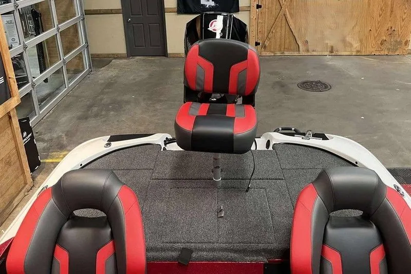 Slide: The Image of Red and black seats on a 2026 Nitro Z18 Pro boat in a garage. - 6