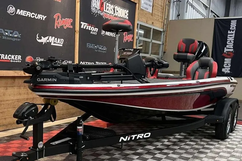 Slide: The Image of 2026 Nitro Z18 Pro fishing boat with Garmin equipment on display in showroom. - 8