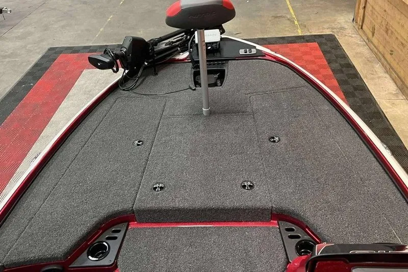 Slide: The Image of 2026 Nitro Z18 Pro boat deck with gray carpet and red accents. - 9