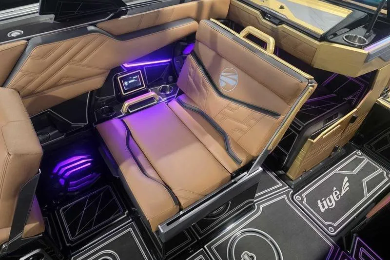 Slide: The Image of Luxurious interior of 2026 Tigé 25ZX boat with modern seating and ambient lighting. - 10