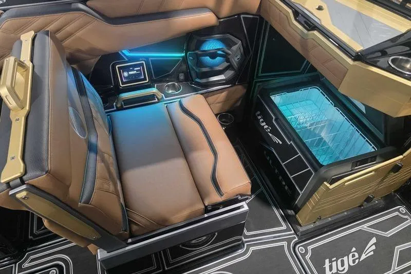 Slide: The Image of 2026 Tigé 25ZX boat interior with luxurious seating and modern dashboard design. - 11