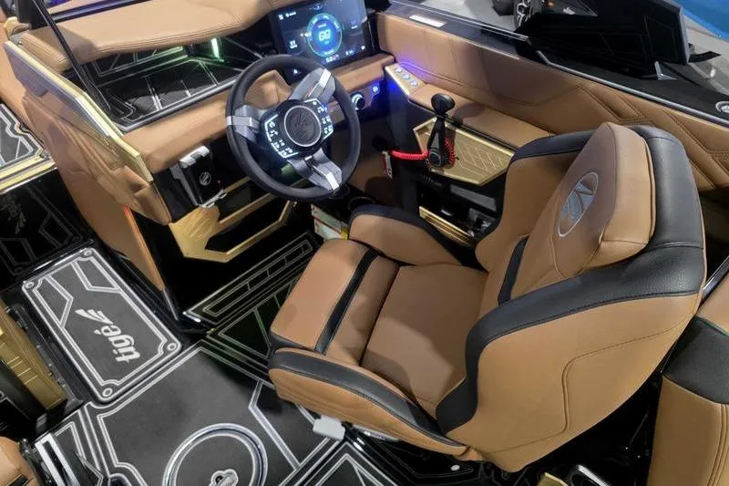 Slide: The Image of 2026 Tigé 25ZX boat interior with modern dashboard and luxurious seating. - 13