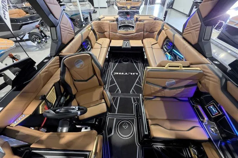 Slide: The Image of Luxurious interior of 2026 Tigé 25ZX boat with tan leather seating and modern design. - 17