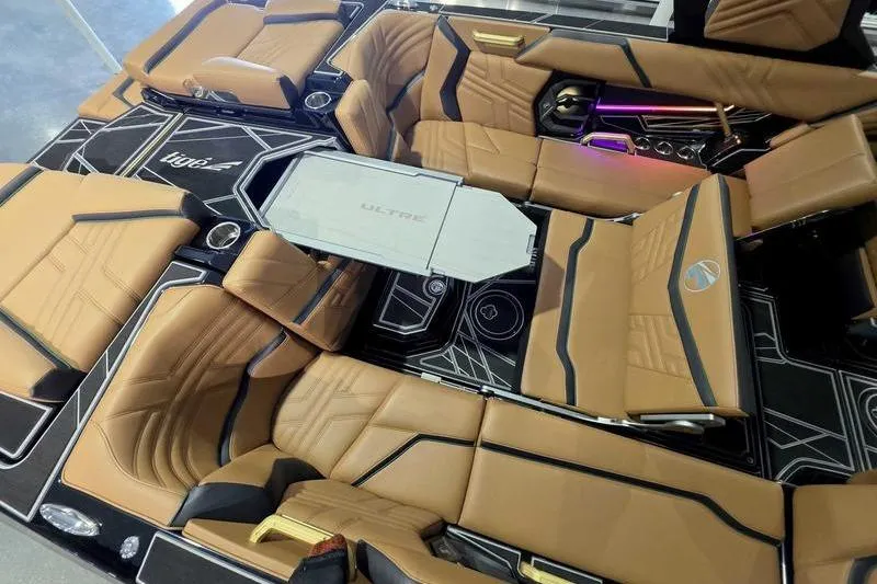 Slide: The Image of Luxurious interior of 2026 Tigé 25ZX boat with tan seating and modern design. - 18