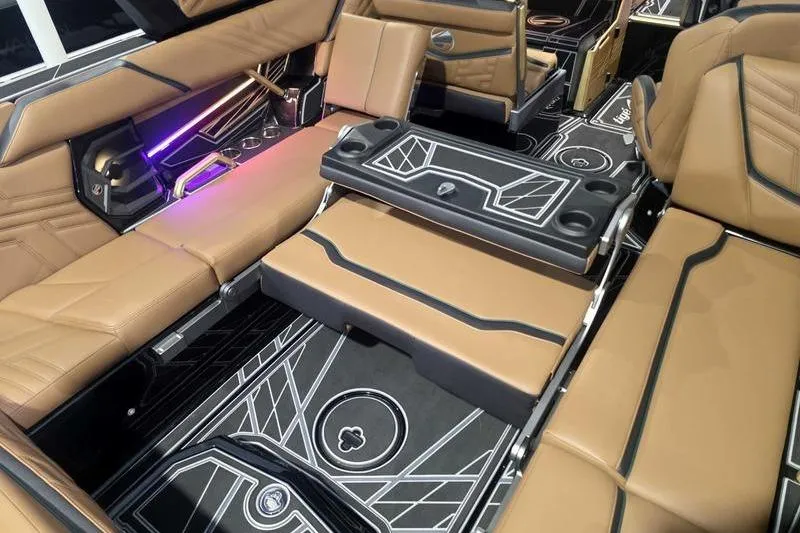 Slide: The Image of Luxurious interior of 2026 Tigé 25ZX boat with tan seating and modern design. - 19
