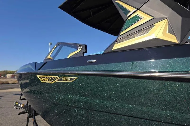 Slide: The Image of 2026 Tigé 25ZX boat with sleek design and metallic finish. - 9