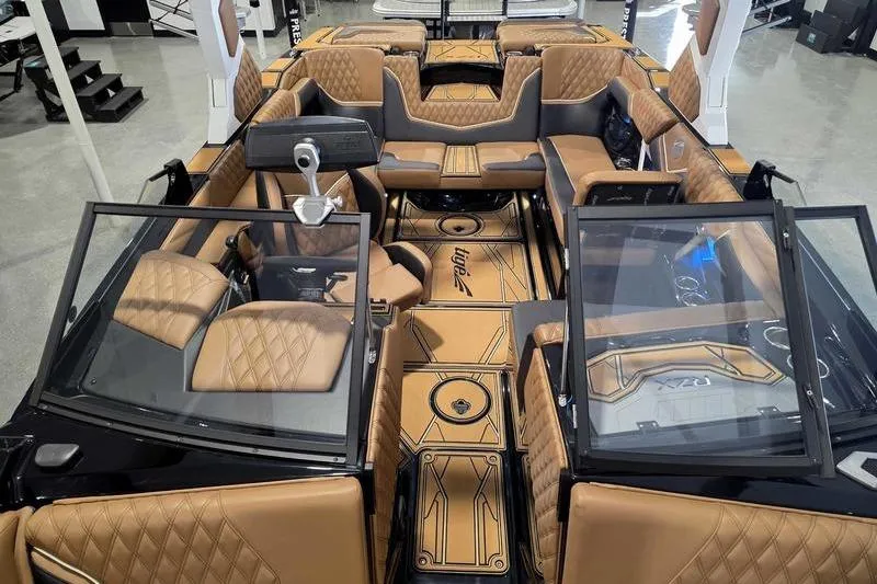 Slide: The Image of 2026 Tigé 22RZX boat interior with luxurious tan leather seating and modern design. - 13