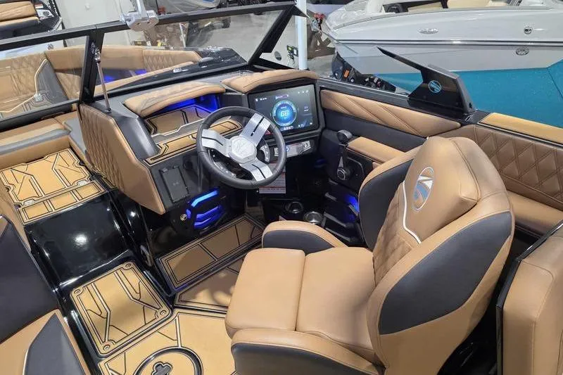 Slide: The Image of 2026 Tigé 22RZX boat interior with modern dashboard, touchscreen, and luxurious seating. - 14