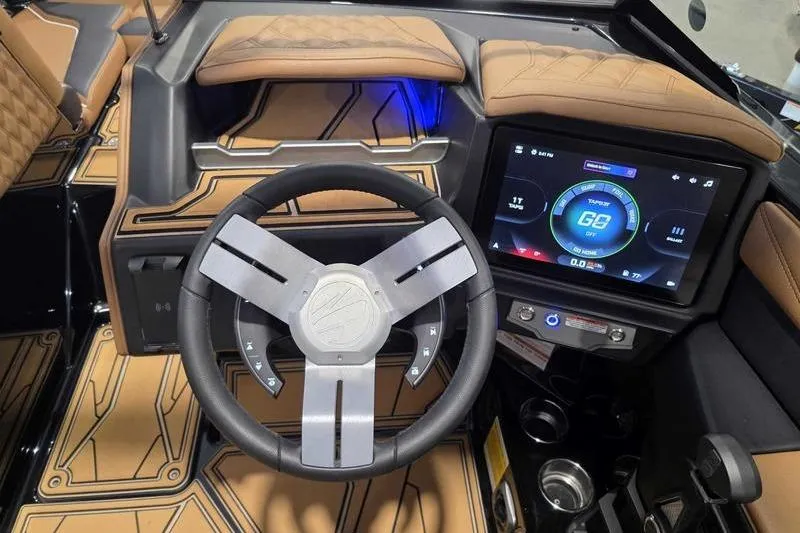 Slide: The Image of 2026 Tigé 22RZX dashboard with modern steering wheel and touchscreen display. - 15