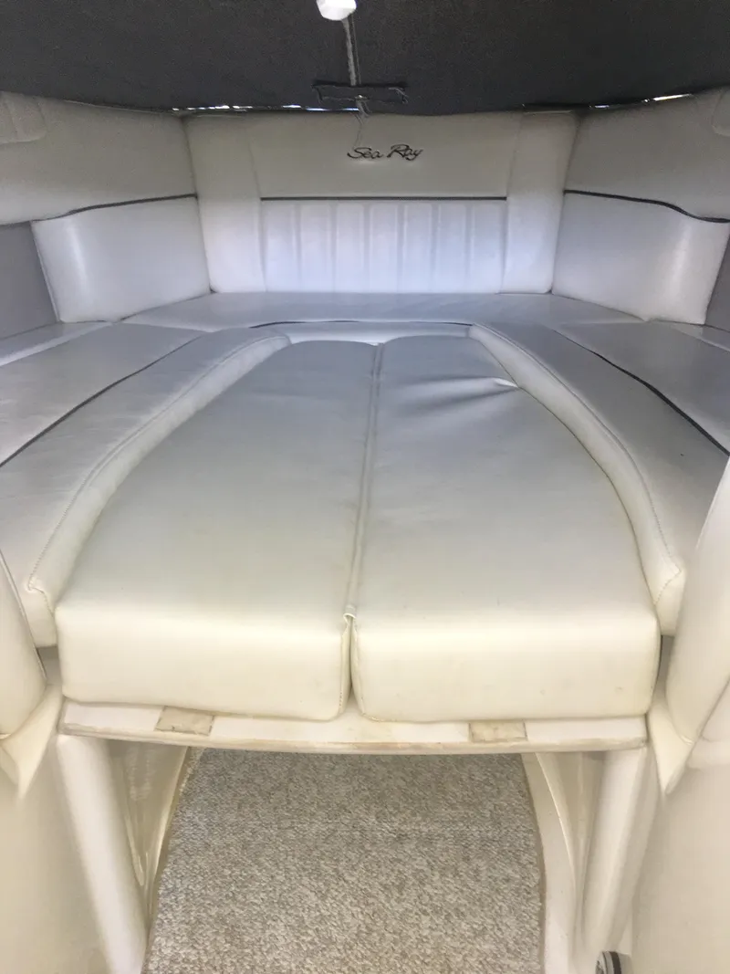 Slide: The Image of Storage compartment in a 2006 Sea Ray 270 SLX boat with life jacket and sponge. - 9