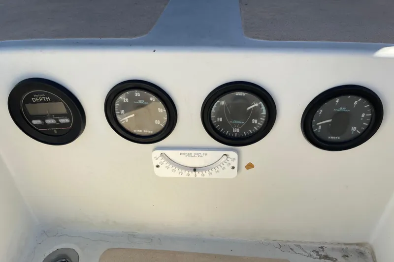 Slide: The Image of Control panel of a 1978 Downeast 38 boat with various gauges. - 18