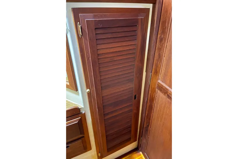 Slide: The Image of Wooden louvered door inside a 1978 Downeast 38 boat interior. - 37